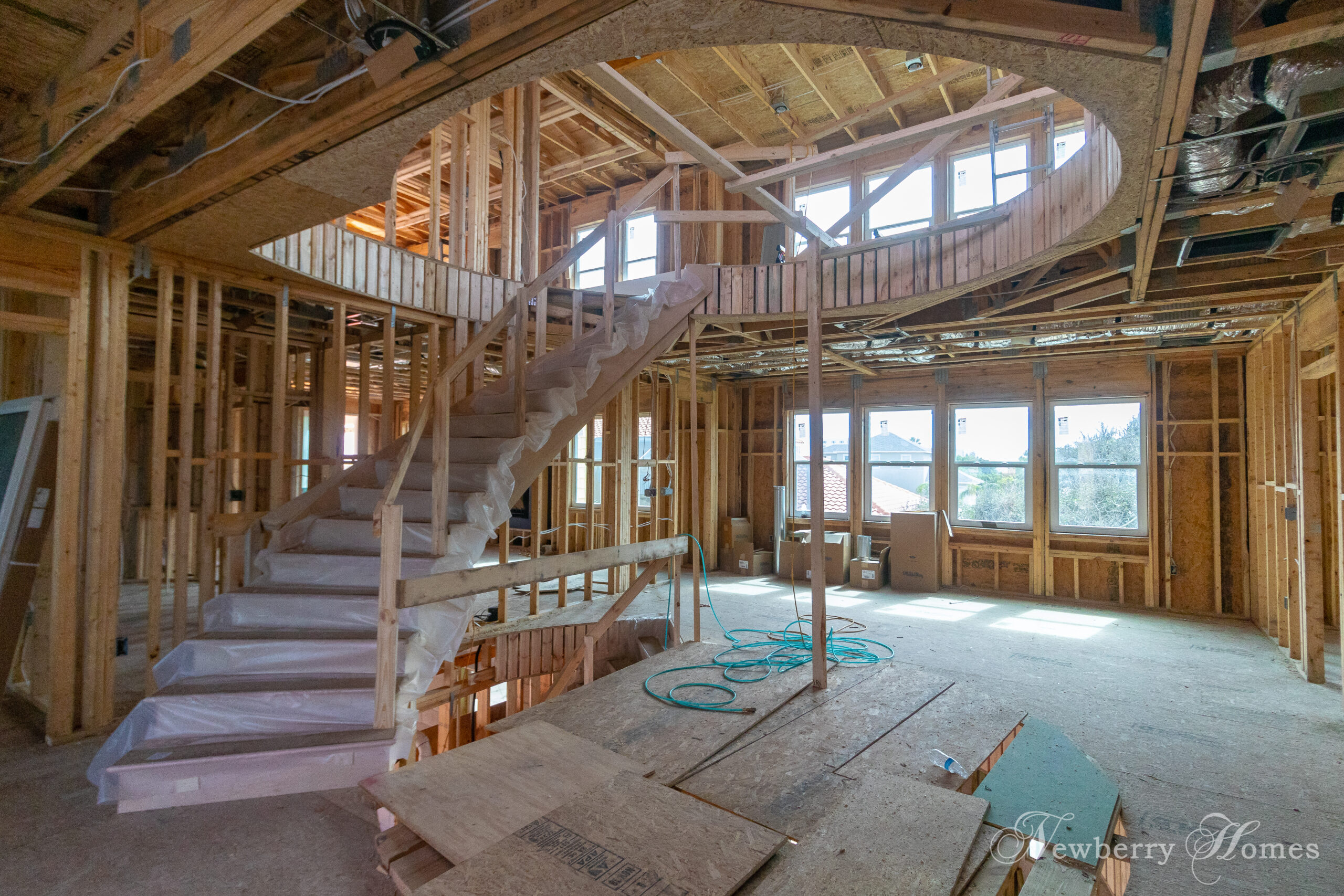 wood frame and steps of a curved staircase in a home under construction