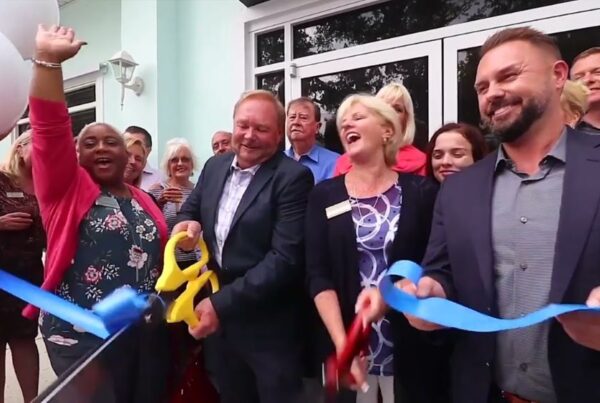 The Newberry team celebrates the opening of a new office with ribbon cutting ceremony