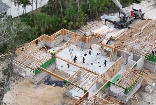 Aerial view of framed house construction site for Japanese inspired custom home