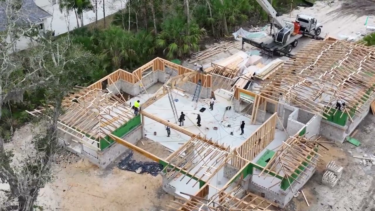 Aerial view of framed house construction site for Japanese inspired custom home