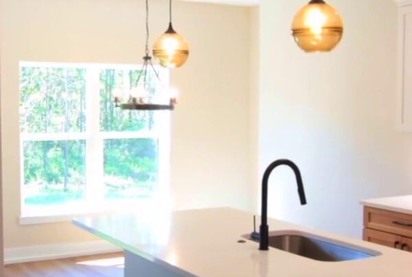 kitchen island and dining area in a finished steel frame home project